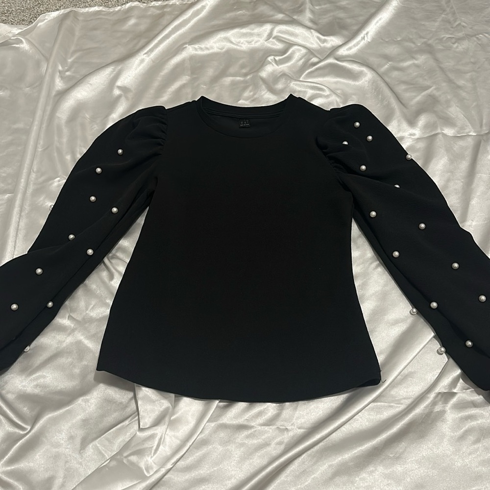 Black long sleeve with pearl accents on sleeves